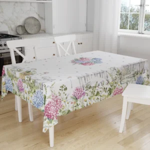 Tovaglia Tiffany 25 by Vingi con ortensie colorate e oche bianche in stile country chic