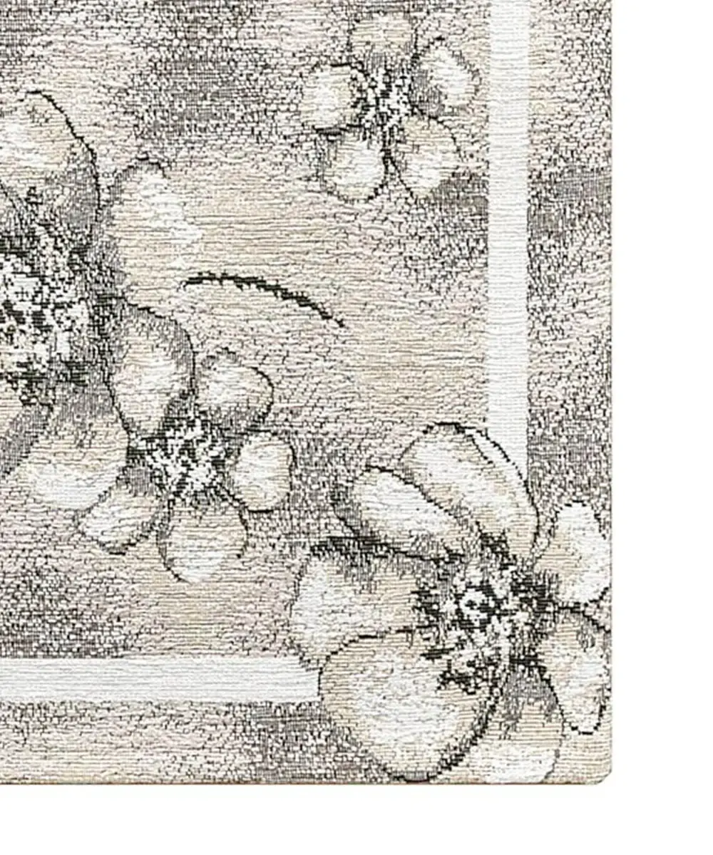 Dettaglio dei fiori jacquard e del bordo del tappeto Emily Grigio in chenille