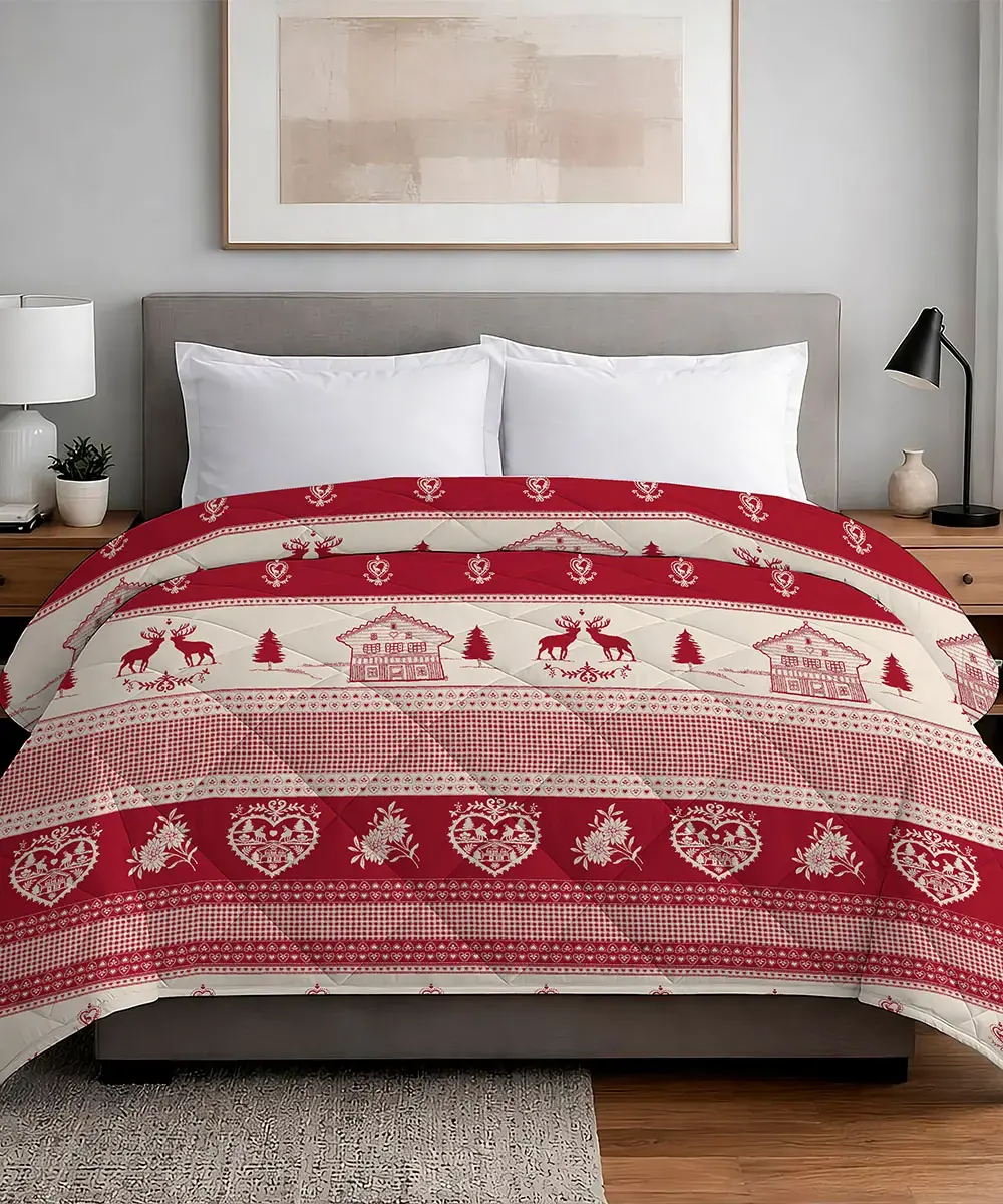 Trapunta Tirolo 300 g invernale con renne, alberi e casette su fondo beige e rosso - foto 1